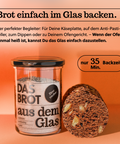 Glas mit Brotbackmischung "Das Brot aus dem Glas" und angeschnittenem Brotlaib. Perfekt für Käseplatten, Anti-Pasti und Ofengerichte. Backzeit: 35 Minuten.